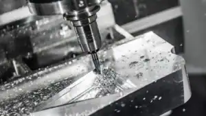 Advanced 5-axis CNC machining center performing high-precision aerospace machining on a titanium turbine component with micron-level tolerances