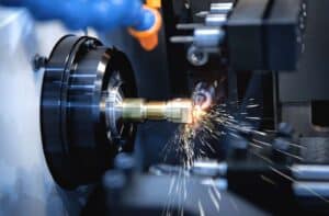 Swiss-type CNC lathe producing small-diameter precision turned components for medical and aerospace applications